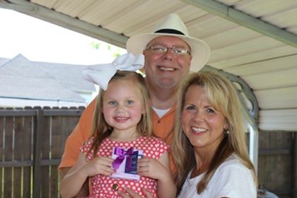 Lola holding her pearl